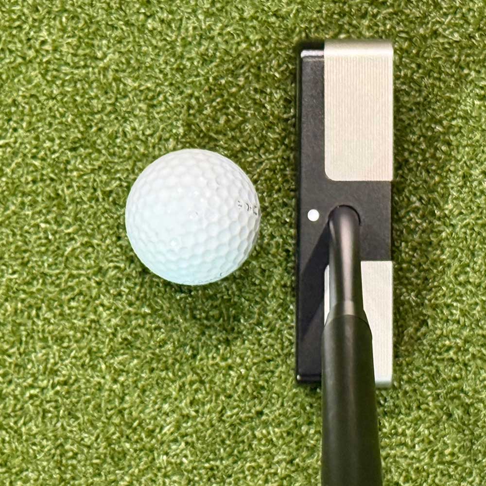 BGT Paradox Blade Putters and ball on a green putting surface