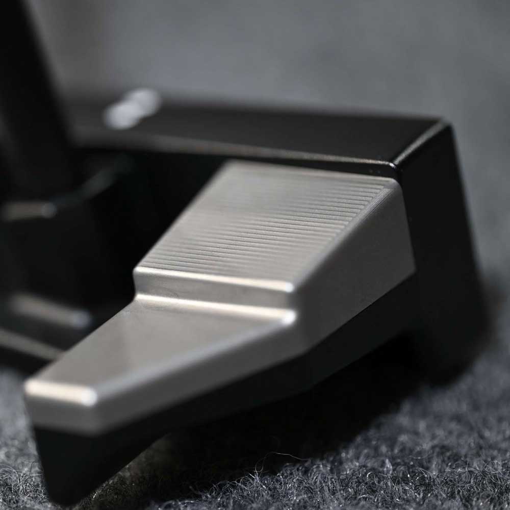 Close-up of a BGT Paradox Mallet Putter on a dark textured surface in Bangkok