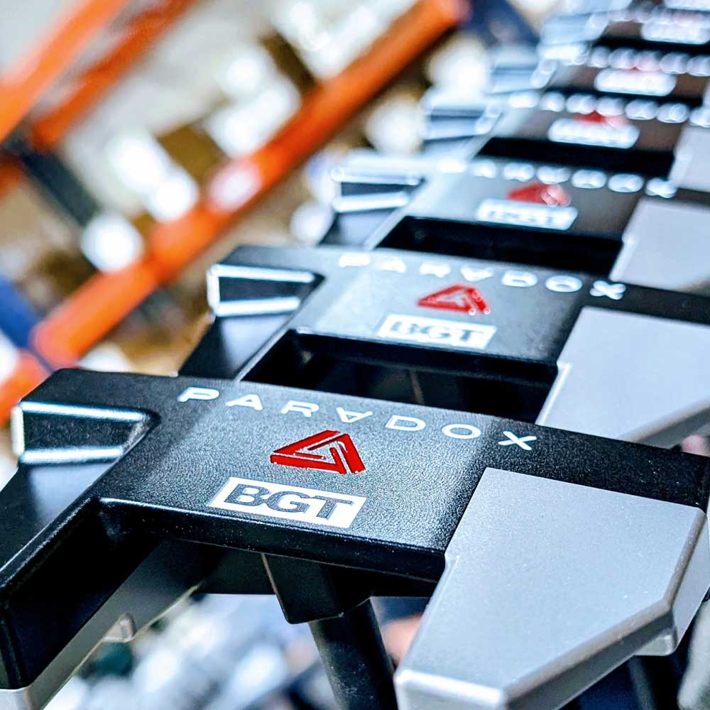 Close-up of BGT Paradox Mallet Putter with blurred warehouse in Thailand background