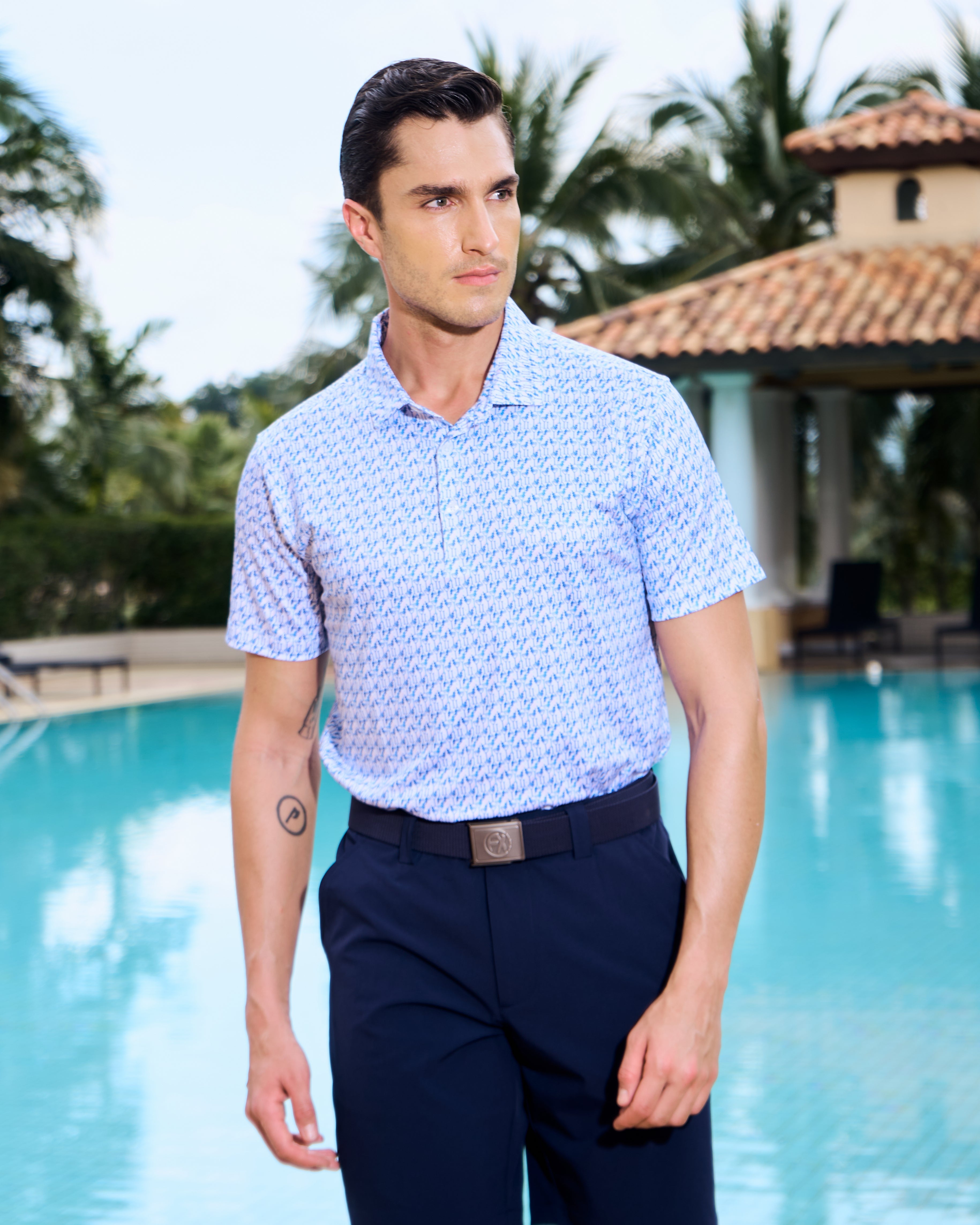 Fenix XCell performance golf polo featuring moisture-wicking fabric and tailored athletic fit. Martini glass print.