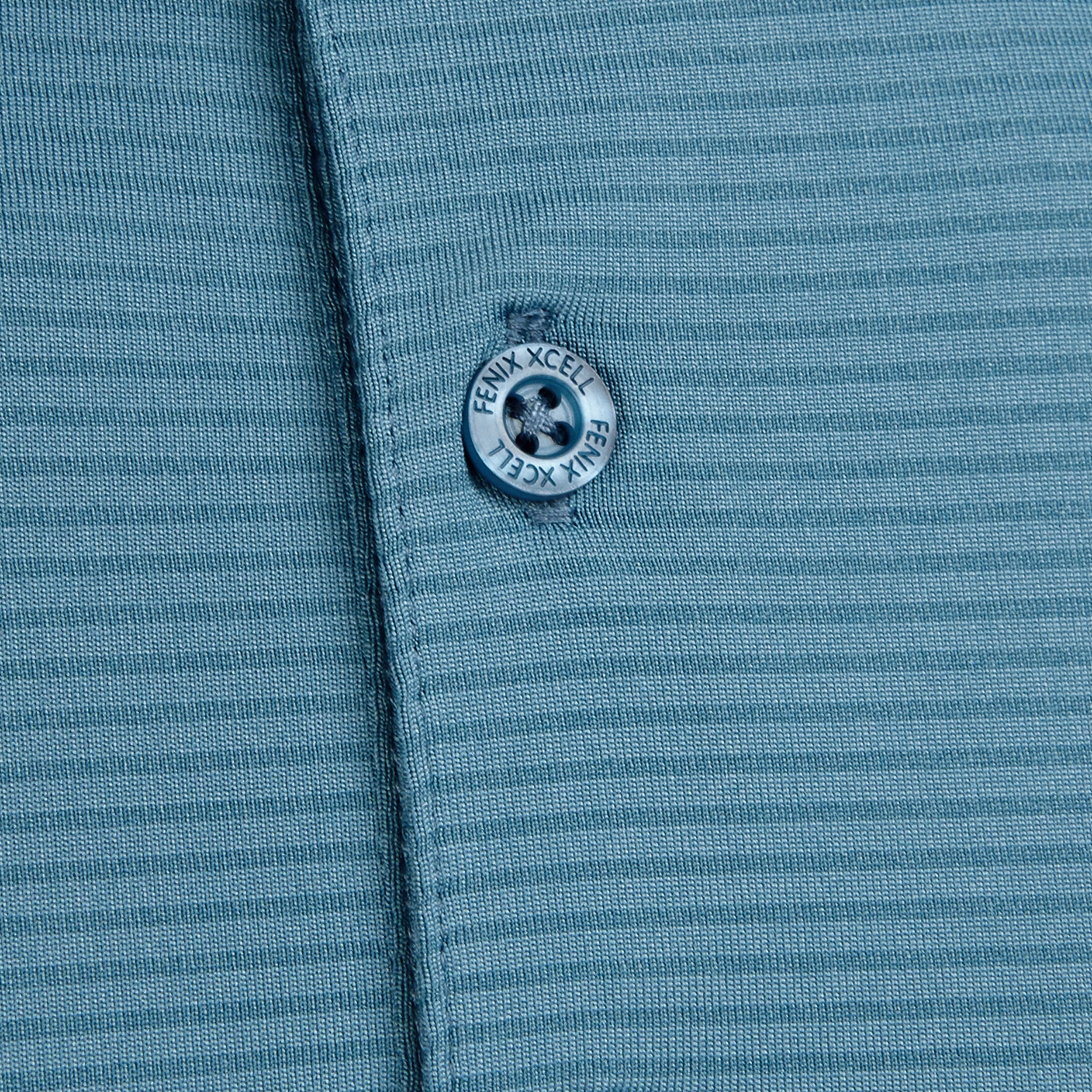 Fenix XCell  blue performance golf polo featuring moisture-wicking fabric and tailored athletic fit.Close up of button.