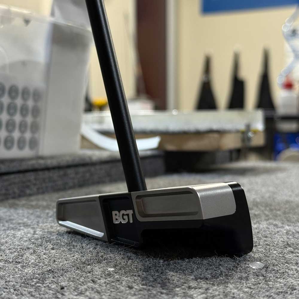 BGT Paradox Blade Putters with BGT logo on a gray surface