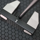 Close-up of a BGT Paradox Mallet Putterwith a black and silver design on a textured black background in Thailand
