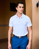 Side angle of men’s white golf polo in moisture-wicking fabric – Fenix XCell custom apparel, sweat-resistant performance shirt.