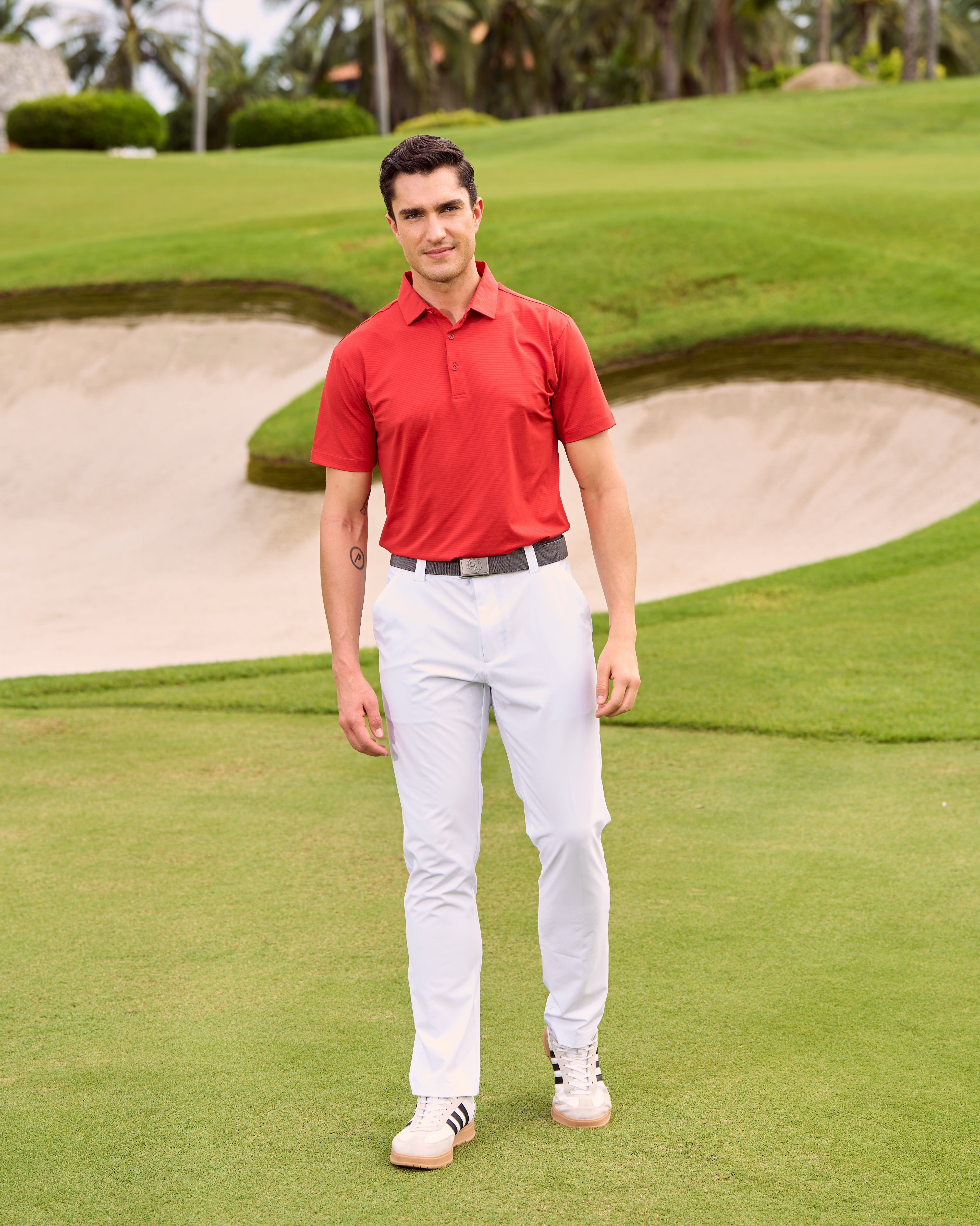 Fenix XCell red performance golf polo featuring moisture-wicking fabric and tailored athletic fit.