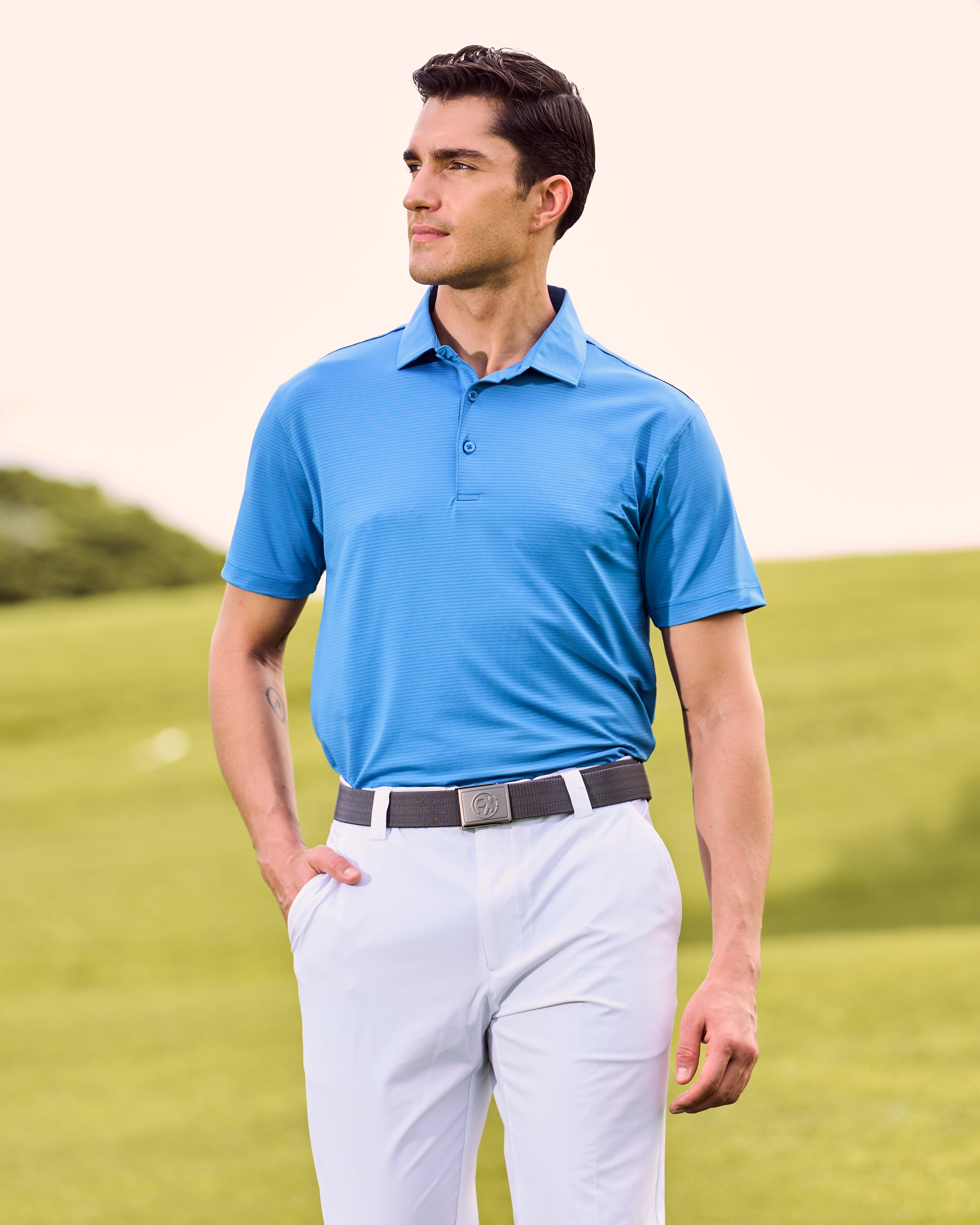 Fenix XCell french blue performance golf polo featuring moisture-wicking fabric and tailored athletic fit.