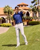 Fenix XCell blue performance golf polo featuring moisture-wicking fabric and tailored athletic fit.