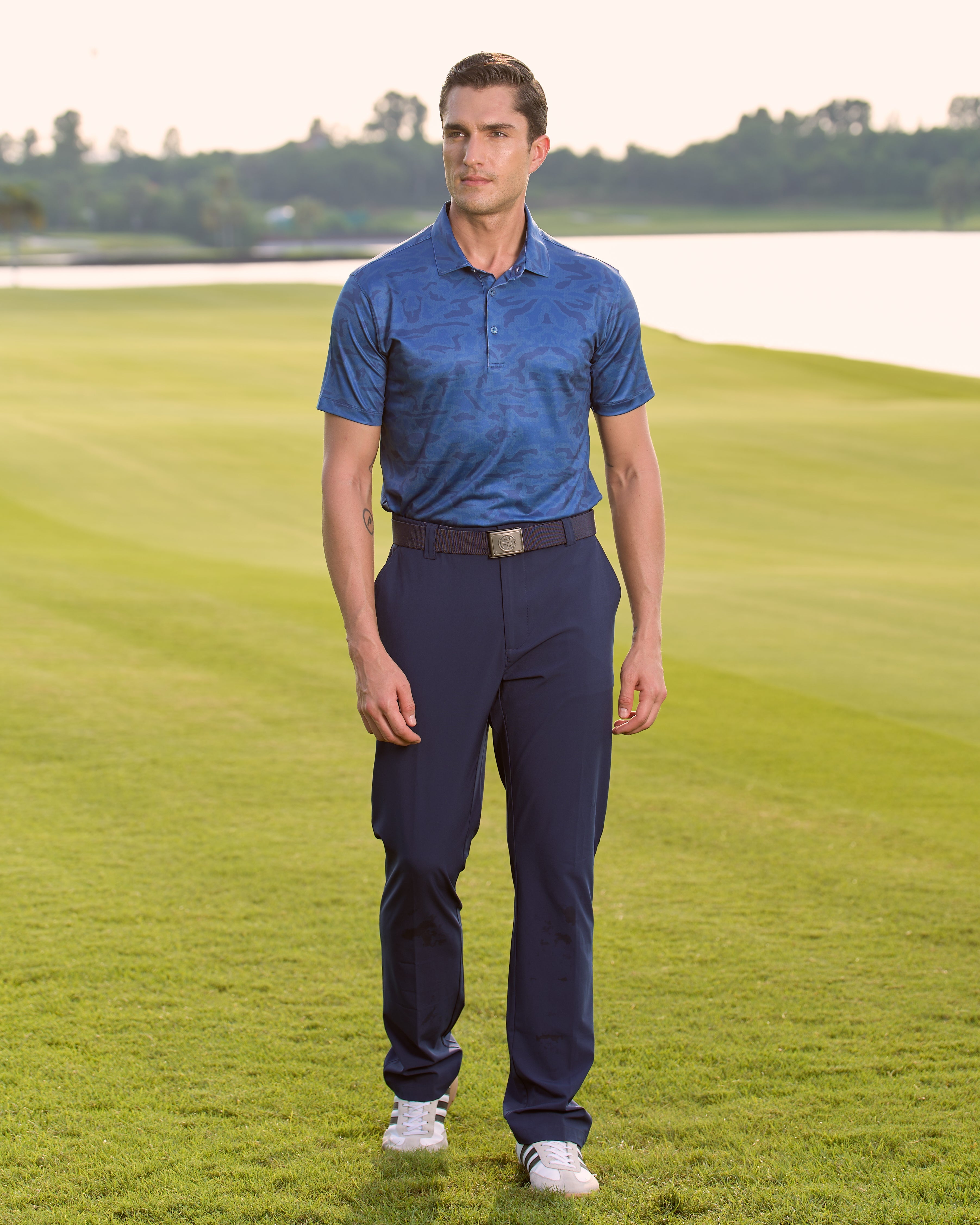 Fenix XCell navy camo print performance golf polo featuring moisture-wicking fabric and tailored athletic fit.
