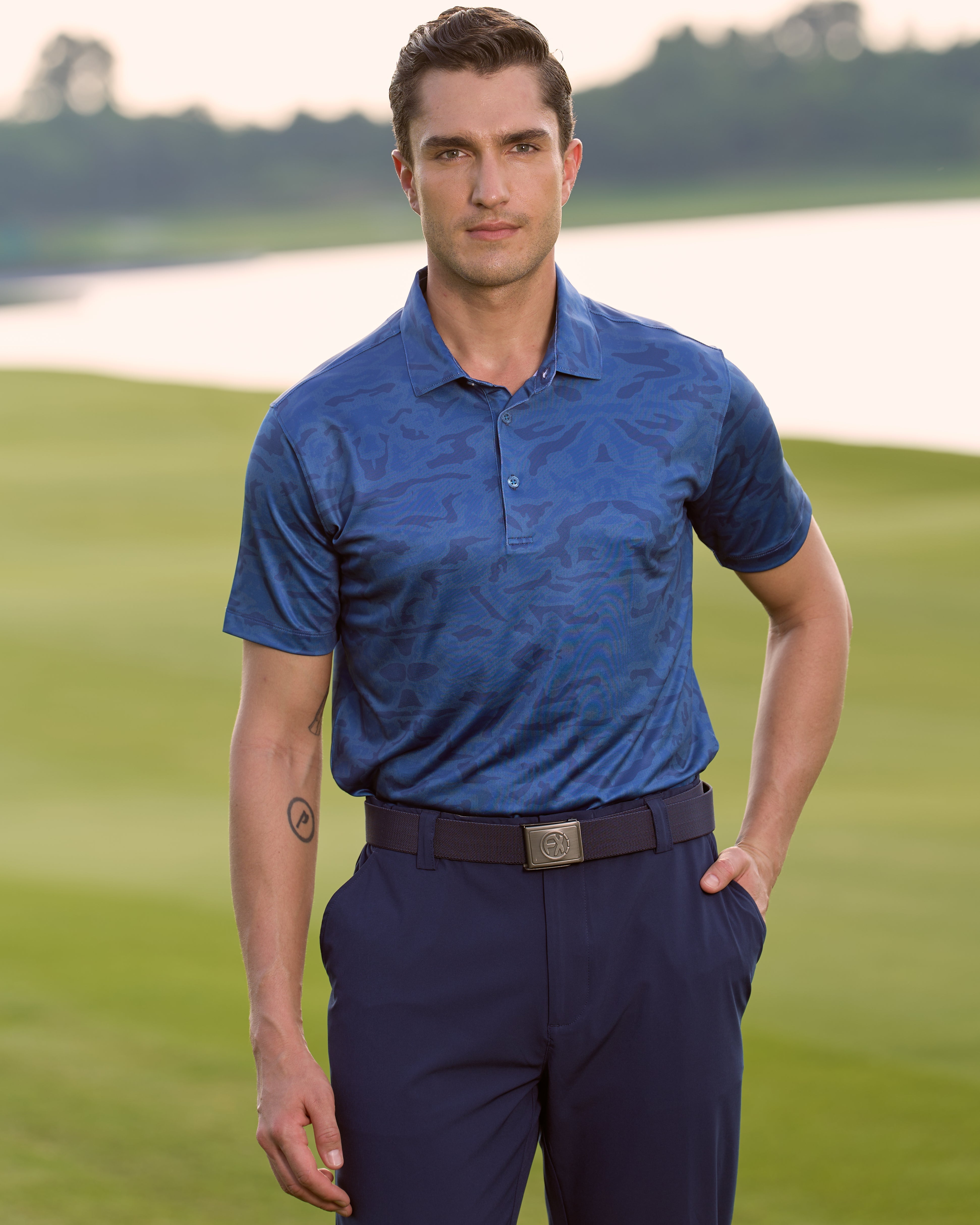 Fenix XCell navy camo print performance golf polo featuring moisture-wicking fabric and tailored athletic fit.