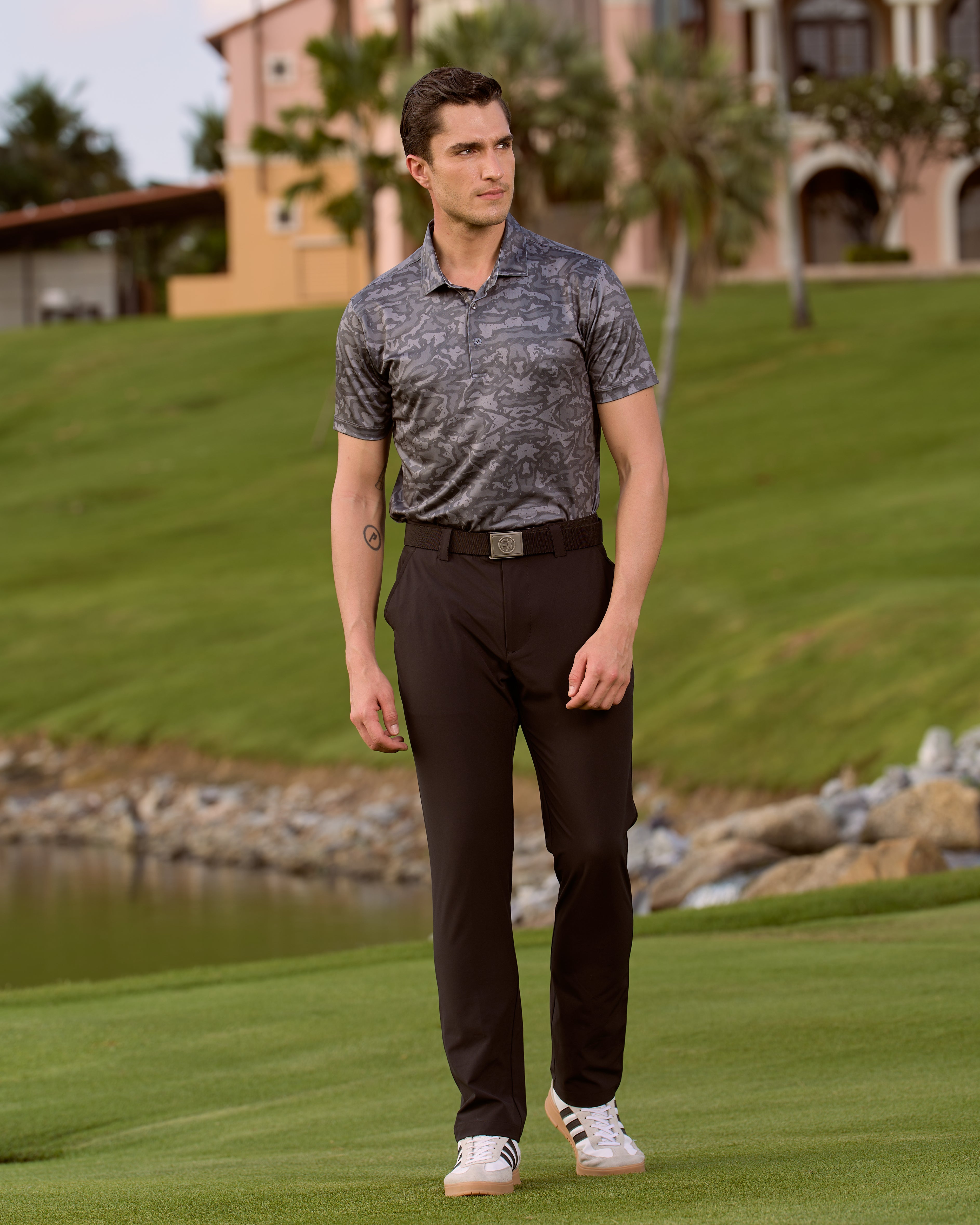 Fenix XCell graphite camo print performance golf polo featuring moisture-wicking fabric and tailored athletic fit.