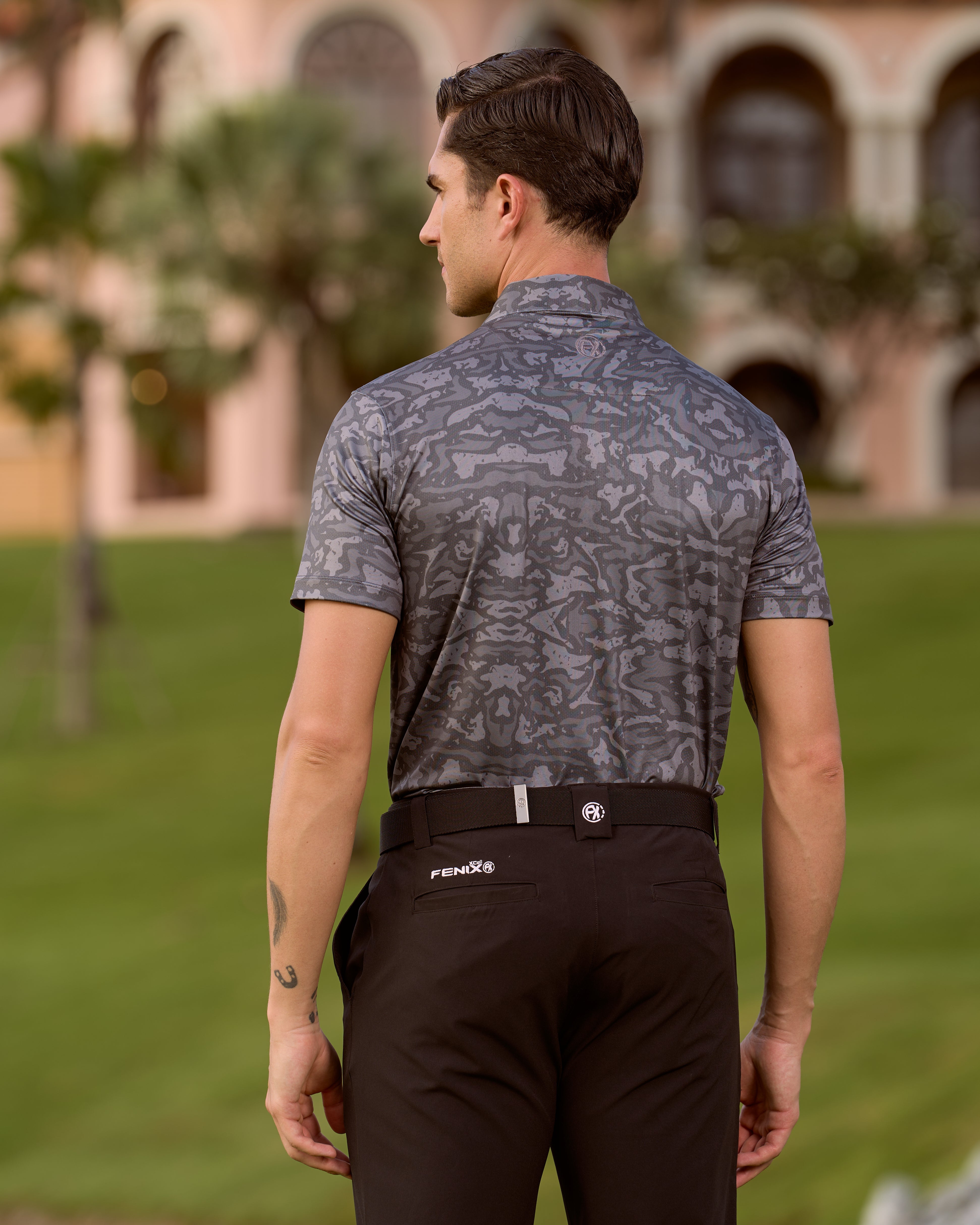 Fenix XCell graphite camo print performance golf polo featuring moisture-wicking fabric and tailored athletic fit.