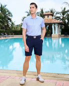 Fenix XCell performance golf polo featuring moisture-wicking fabric and tailored athletic fit. Martini glass print.